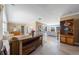 Open living room with tile flooring, multiple seating areas, and views to an outdoor space at 260 Hammock Ter, Venice, FL 34293