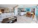 Open-concept living space includes kitchen, dining, and living areas at 260 Hammock Ter, Venice, FL 34293