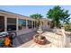 Cozy patio with a fountain, comfortable seating, and well-maintained landscaping at 260 Hammock Ter, Venice, FL 34293