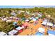 Vibrant aerial view of an outdoor marketplace filled with colorful vendor tents and bustling with shoppers at 347 Ardenwood Dr, Englewood, FL 34223