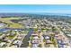 Scenic aerial view of a charming neighborhood nestled between lush greenery and a winding waterfront at 347 Ardenwood Dr, Englewood, FL 34223