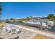 Picturesque backyard featuring a private dock, boat lift, and comfortable seating area for waterfront enjoyment at 347 Ardenwood Dr, Englewood, FL 34223