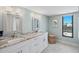 Bright bathroom features double vanity with granite countertop and decorative touches at 347 Ardenwood Dr, Englewood, FL 34223