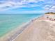 Expansive beach view featuring soft sand and tranquil turquoise waters, perfect for relaxation and recreation at 347 Ardenwood Dr, Englewood, FL 34223