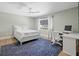 Bedroom with white linens, a work space, and ample natural light at 347 Ardenwood Dr, Englewood, FL 34223