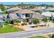 Beautifully landscaped home with a three car garage, circular driveway, and well-maintained lawn at 347 Ardenwood Dr, Englewood, FL 34223