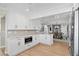 Charming kitchen featuring white cabinets, modern appliances, and an open layout at 347 Ardenwood Dr, Englewood, FL 34223