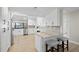Bright kitchen with white cabinets, stainless appliances, and stylish countertops at 347 Ardenwood Dr, Englewood, FL 34223
