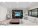 Comfortable living room featuring a built-in entertainment center and plush seating at 347 Ardenwood Dr, Englewood, FL 34223
