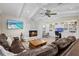 Inviting living room boasts a stone fireplace, beamed ceilings, built-ins and hardwood floors at 347 Ardenwood Dr, Englewood, FL 34223