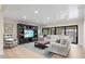 Bright and inviting living room with large windows and a cozy seating area, perfect for relaxation at 347 Ardenwood Dr, Englewood, FL 34223