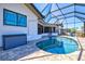 Enclosed pool with brick patio is surrounded by glass and offers plenty of space to relax and enjoy the sunshine at 347 Ardenwood Dr, Englewood, FL 34223