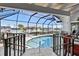 Sparkling pool surrounded by a screened enclosure with a picturesque canal view at 347 Ardenwood Dr, Englewood, FL 34223