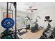 Home workout room fully equipped with weights, treadmill, and elliptical machine at 347 Ardenwood Dr, Englewood, FL 34223