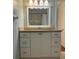 Bathroom vanity offers ample storage with white cabinets and drawers at 411 El Greco Dr, Brandon, FL 33511