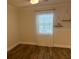 Bedroom with wood floors and natural light at 411 El Greco Dr, Brandon, FL 33511