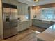Modern kitchen featuring stainless steel appliances, custom cabinets, and butcher block countertops at 411 El Greco Dr, Brandon, FL 33511