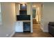 Attractive living space features a beverage cooler, built-in storage, and hardwood floors at 411 El Greco Dr, Brandon, FL 33511