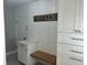 Mudroom area with shiplap and wood bench at 411 El Greco Dr, Brandon, FL 33511