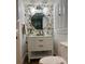 Stylish powder room with patterned wallpaper and modern vanity at 411 El Greco Dr, Brandon, FL 33511
