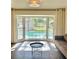 Bright sitting area with large bay window overlooking a pool, offering a relaxing view and ample natural light at 411 El Greco Dr, Brandon, FL 33511
