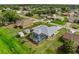 Aerial view showcases a screened-in pool and lanai, adjacent to well-maintained landscaping at 4268 Mulgrave Ave, North Port, FL 34287