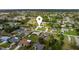 Aerial view of a neighborhood with cozy homes, mature trees, and well-maintained landscaping at 4268 Mulgrave Ave, North Port, FL 34287