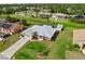 Aerial view of a well-manicured home featuring a backyard shed and screened-in lanai at 4268 Mulgrave Ave, North Port, FL 34287