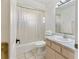 Bathroom featuring a shower-tub combo, tile flooring and single sink vanity at 4268 Mulgrave Ave, North Port, FL 34287