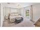 Light and bright main bedroom with ceiling fan and sliding doors to patio at 4268 Mulgrave Ave, North Port, FL 34287
