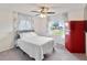 Comfortable bedroom with fan, window and mini fridge at 4268 Mulgrave Ave, North Port, FL 34287