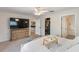 Spacious bedroom with large TV, dresser, and walk-in closet is bright and inviting at 4268 Mulgrave Ave, North Port, FL 34287