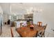 Open kitchen and dining room area with stainless steel appliances and modern lighting at 4268 Mulgrave Ave, North Port, FL 34287
