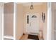 A view of the front door, and the light and bright entryway at 4268 Mulgrave Ave, North Port, FL 34287