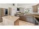 Updated kitchen with stainless appliances, granite counters, and open view to living area at 4268 Mulgrave Ave, North Port, FL 34287