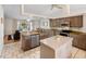 Updated kitchen with stainless appliances, granite counters, and open view to living area at 4268 Mulgrave Ave, North Port, FL 34287