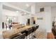 Bright, open kitchen with granite countertops, stainless steel appliances, and bar seating at a large island at 4268 Mulgrave Ave, North Port, FL 34287
