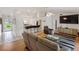 Cozy living room with breakfast bar and view to front entrance at 4268 Mulgrave Ave, North Port, FL 34287