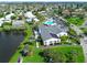 Aerial view of the community amenities, including a pool, community center, and scenic lake at 4411 Mount Vernon Dr, Bradenton, FL 34210