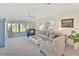 Cozy living room with neutral tones, comfortable seating, and serene outdoor views at 4411 Mount Vernon Dr, Bradenton, FL 34210