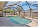 Enclosed pool area with a waterfall feature providing a private and relaxing backyard retreat for leisure and recreation at 4450 Diamond S Cir, Sarasota, FL 34233