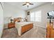 Comfortable bedroom with wooden furniture, carpeted floors, and natural light at 4691 Claremont Park Dr, Bradenton, FL 34211