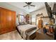 Modern bedroom featuring a large wardrobe, comfortable bed, and overhead lighting at 4691 Claremont Park Dr, Bradenton, FL 34211