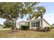 Charming single-story home with a well-manicured front yard, mature trees and attached garage at 4691 Claremont Park Dr, Bradenton, FL 34211