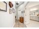 Hallway with carpet flooring leading to a Primary bathroom and bedrooms at 4691 Claremont Park Dr, Bradenton, FL 34211