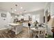Modern kitchen featuring white cabinets, stainless steel appliances, and a cozy breakfast nook at 4691 Claremont Park Dr, Bradenton, FL 34211
