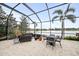 Enjoy the beautiful view of the lake from the screened-in lanai featuring comfortable outdoor seating at 4691 Claremont Park Dr, Bradenton, FL 34211