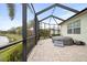 Relax on this screened patio with a spa, with a serene water view for ultimate comfort at 4691 Claremont Park Dr, Bradenton, FL 34211
