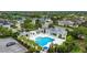 Aerial view of a community pool area showing the pool, cabana, lounge chairs, and landscaping at 4691 Claremont Park Dr, Bradenton, FL 34211