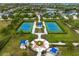 Aerial view of community tennis courts and a park featuring landscaped grounds at 4691 Claremont Park Dr, Bradenton, FL 34211